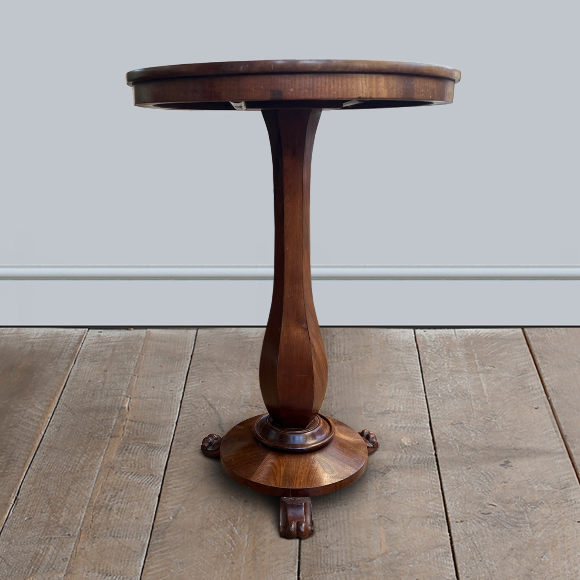 A mahogany occasional table with circular base and scroll feet circa 1835